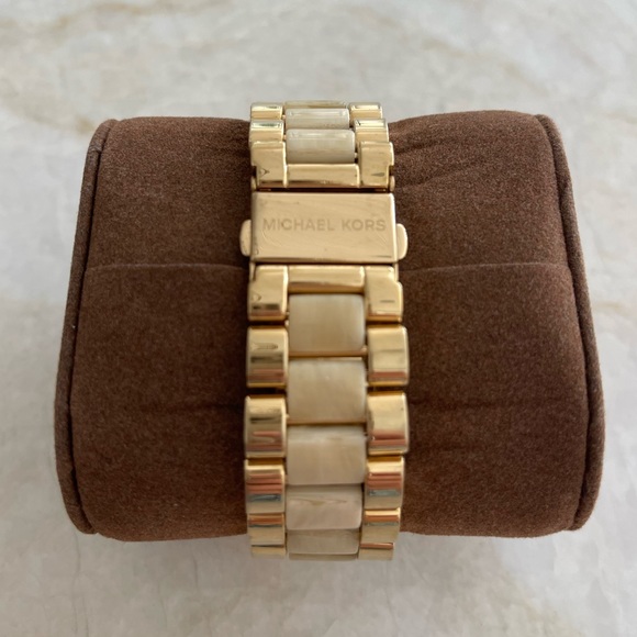 Michael Kors gold & pearlescent watch w/ date display; adjustable band